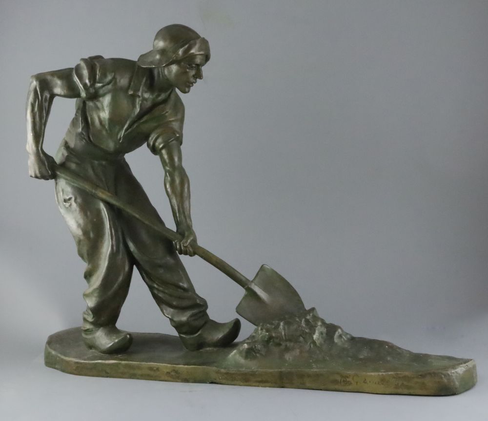 Amedeo Gennarelli (1881-1943). A bronze figure of a labourer shovelling seaweed , Le Ramasseur de Goemon, width 94cm height 52cm
